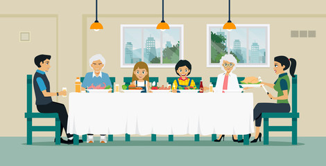 Families sit together to eat food on the table with grandfather and grandmother.