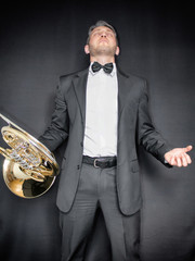 armenian,artist,background,band,black,black background,brass,butterfly,caucasian,classical,elegant,fashion,french,french horn,gold,hairy,hands,horn,hornist,horns,instrument,isolated,jazz,male,man,masc - obrazy, fototapety, plakaty