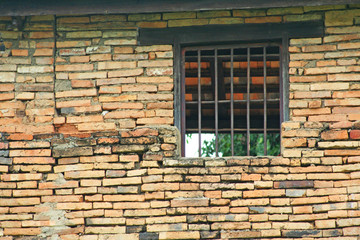 Window on brick wall at Phra that lampangluang temple,Thailand