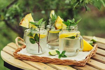 Refreshing chilled lemon water on the garden table.