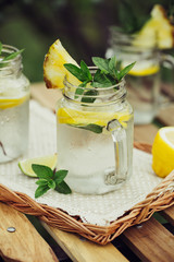 Lemon water in glass jars. Concept for healthy eating and nutrition.