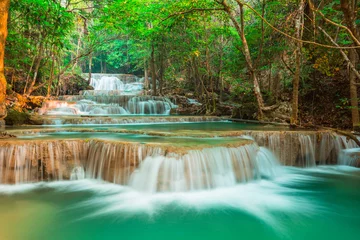 Fototapeten beautiful waterfall in forest, Kanchanaburi province, Thailand © calcassa