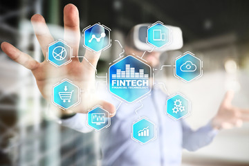 Fintech. Financial technology text on virtual screen. Business, internet and technology concept.?