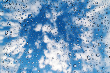 Fototapeta na wymiar Water drops of rain on a window glass.