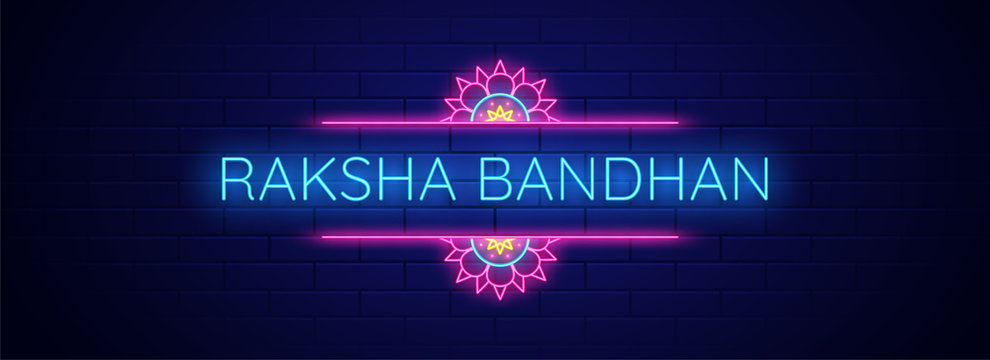 Neon effect text Raksha Bandhan on blue brick wall background.