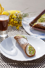 Canoli, typical sicilian dessert, arranged in a plate