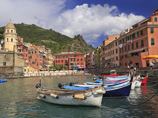 Vernazza harbor on Mediterranean coast with fishing boats on the foreground, Cinque Terre, Italy