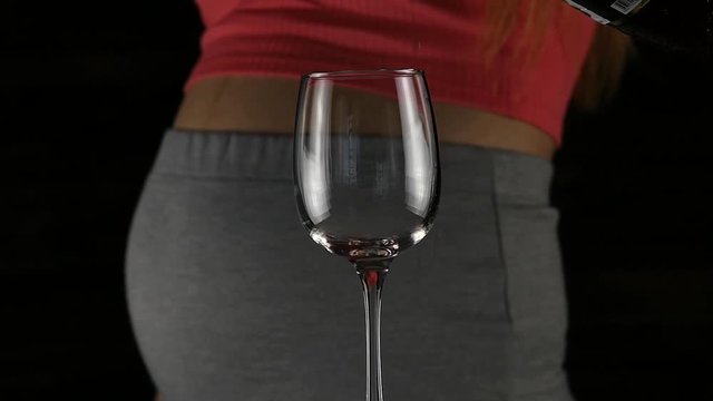close-up pregnant belly, women drinking red wine. Third trimester. motherhood and alcohol concept. slow motion