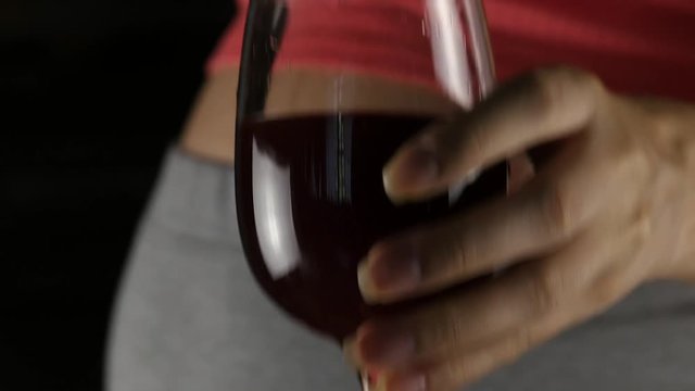 Pregnant women drinking red wine. Third trimester. pregnancy and alcohol concept. 4K