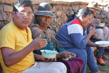 Native american people having dinner in the countryside.