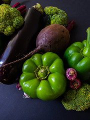 Fresh vegetables on a black background. Food background. Fresh farmer vegetables.