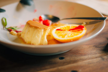 Orange cake on wooden table