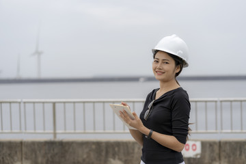 Asian female engineer checking the job.