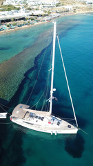 Aerial drone photo of sail boat docked in famous turquoise and sapphire clear water beach of...