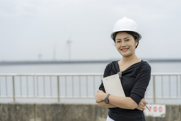 Asian female engineer checking the job.