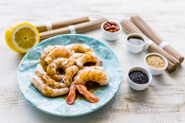 Giant prawns prepared for teriyaki with soba noodles. 