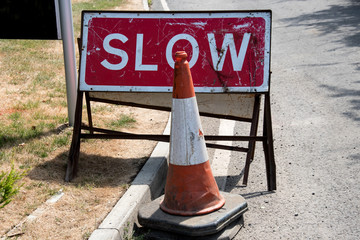 UK slow sign and road cone