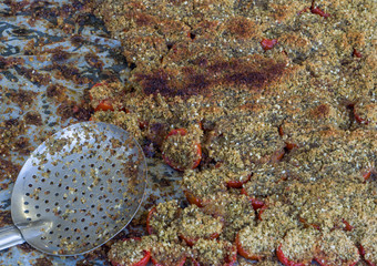 baked tomatoes au gratin covered with chopped breadcrumbs, garlic and parsley