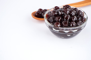 black pearls. Boiled tapioca pearls for bubble tea on white background. Copy space