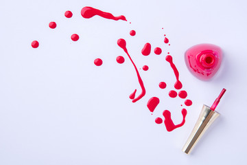 Drops and blots from spilled nail polish on a white background