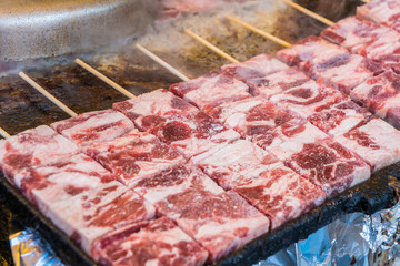 Grilled wagyu beef on hot coal with smoke (Japanese Food)