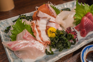 Salmon raw sashimi sushi with shrimp on plate, japanese food