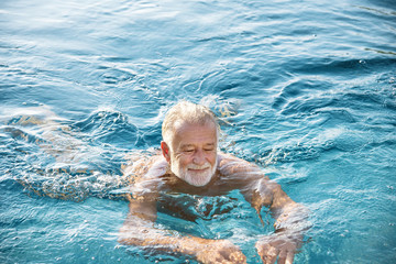 Mature man in a swimming pool