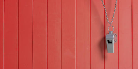 Coach whistle with chain, isolated on red wooden background, copy space. 3d illustration