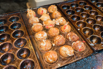 process to cooking Takoyaki most popular delicious snack of japan at Tokyo street food