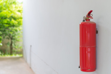 Fire Extinguisher on white wall at home or office