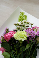 pink bouquet of carnations and roses.  bouquet of flowers indoor in flower shop. Close up. Top view. Mother's Day and Valentine's Day concept 