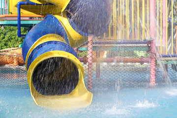 slider ride in swimming pool at water park
