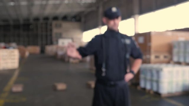 anonymous Polish customs officer talks in the warehouse
