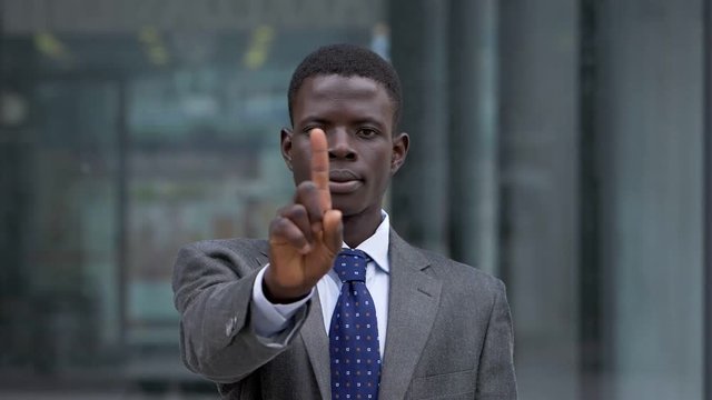 Black afriican business man making NO with his hand- slow motion