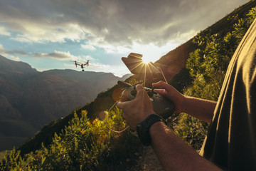 Nature photographer shooting on mountains with drone