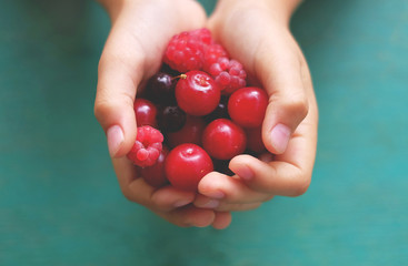 fresh berries in hands