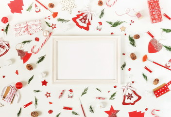 Christmas background pattern from red and white Christmas decorations and frame mock up . Xmas composition of New Year's Christmas balls. Winter holiday concept.Flat lay. Top view. Copy space