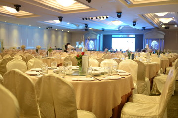 HO CHI MINH CITY, VIET NAM, MARCH, 2018: Original wedding floral decoration in the form of mini-vases and bouquets of flowers put in the table with beautiful mat, green style wedding, a modern wedding