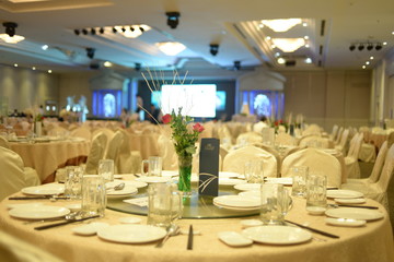 HO CHI MINH CITY, VIET NAM, MARCH, 2018: Original wedding floral decoration in the form of mini-vases and bouquets of flowers put in the table with beautiful mat, green style wedding, a modern wedding