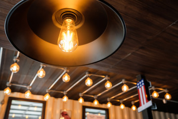 Vintage light bulb in coffee shop,classic and retro concept style.