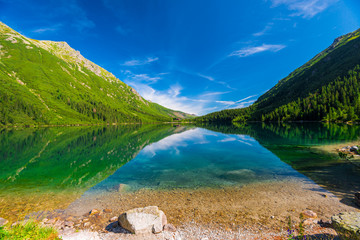 Naklejka na ściany i meble Blue Lake Morskie Oko and the green mountains of Tara, Poland
