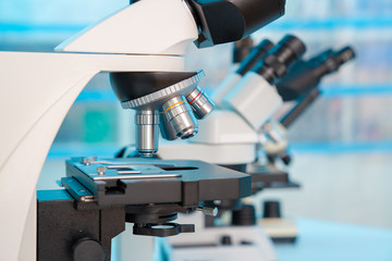 Four microscopes of different designs in the laboratory