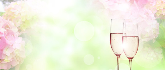 Tender pink blossoms background with champagne