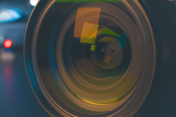 Photo Camera or Video lens close-up on black background DSLR objective