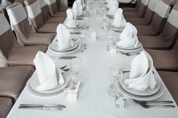 Elegant set table, Set dishes and chairs, wedding preparation.