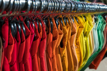 Male Mens Shirts on Hangers in Thrift Shop or Wardrobe Closet Rail