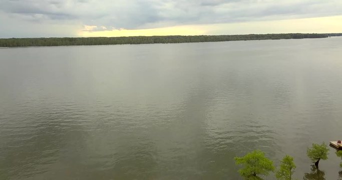 Fly Over Open Lake Into Sunset