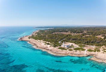 Fototapeta premium Aerial: Cape Ses Salines lighthouse in Mallorca