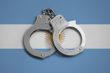 Argentina flag  and police handcuffs. The concept of observance of the law in the country and...