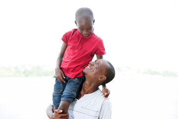 happy family, father and son strolling together outdoors